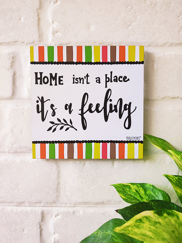 Home isn't a place its a feeling | 6 inches Square Hangings or Stick-ons