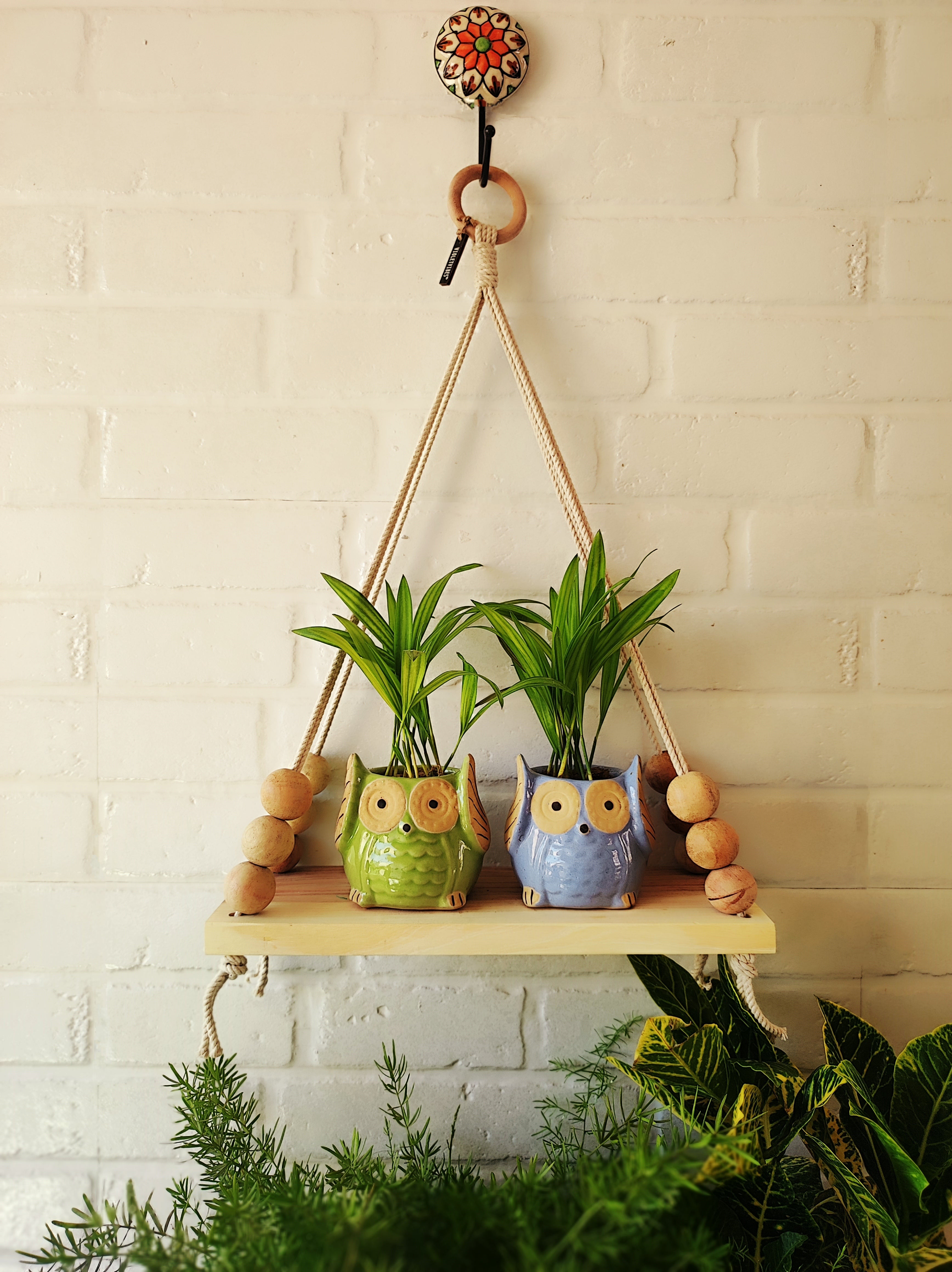 Natural Wood Macrame Shelf with owl planters and a ceramic hook