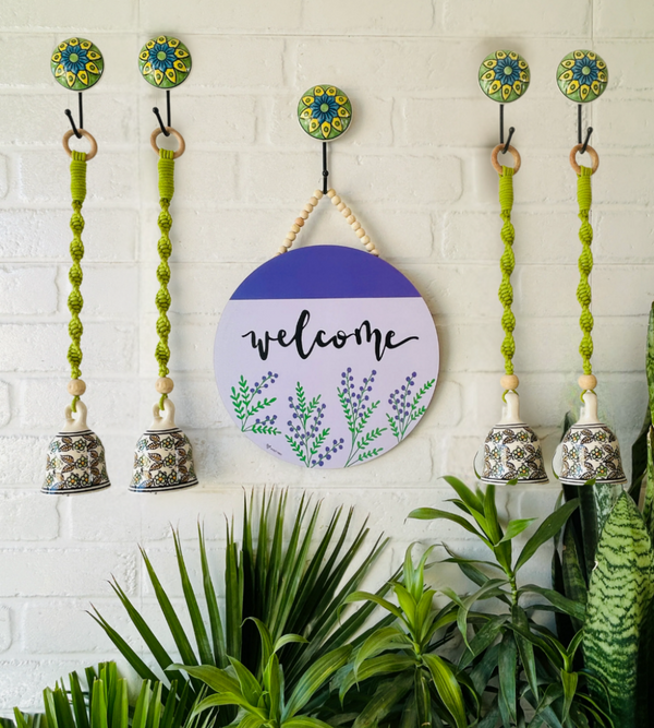 Welcome wall set up with four green macrame bells  and ceramic hooks