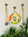 Good vibes only wall set up with two lemon yellow macrame bells