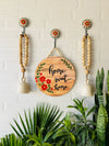 Home sweet home wall set up with two beaded bells