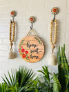 Home sweet home wall set up with two beaded bells